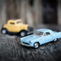 Toy vintage car on wooden background