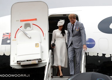 The Duke and Duchess of Sussex disembark from their plane on their arrival in Suva, on day one of th...