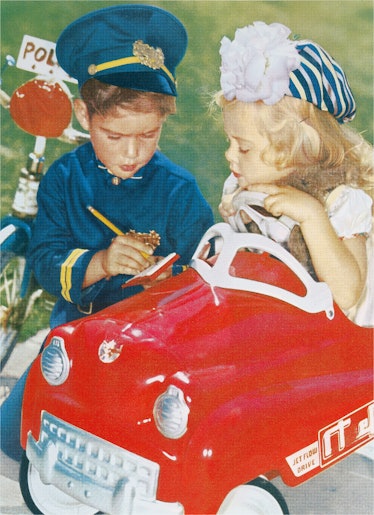 Vintage color photography illustration of a boy and a girl playing cops with the boy dressed in a bl...