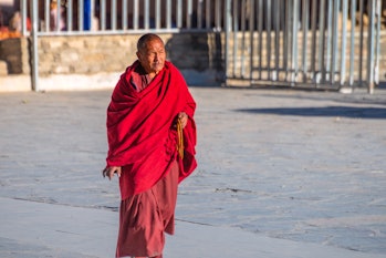 Tibetan man holding Buddhist Rosary in the complex of Perklor Monastery, Gyantse, Tibet, China - Oct...