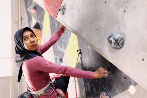 A woman in hijab boulders. Here’s your June 6 zodiac sign horoscope.