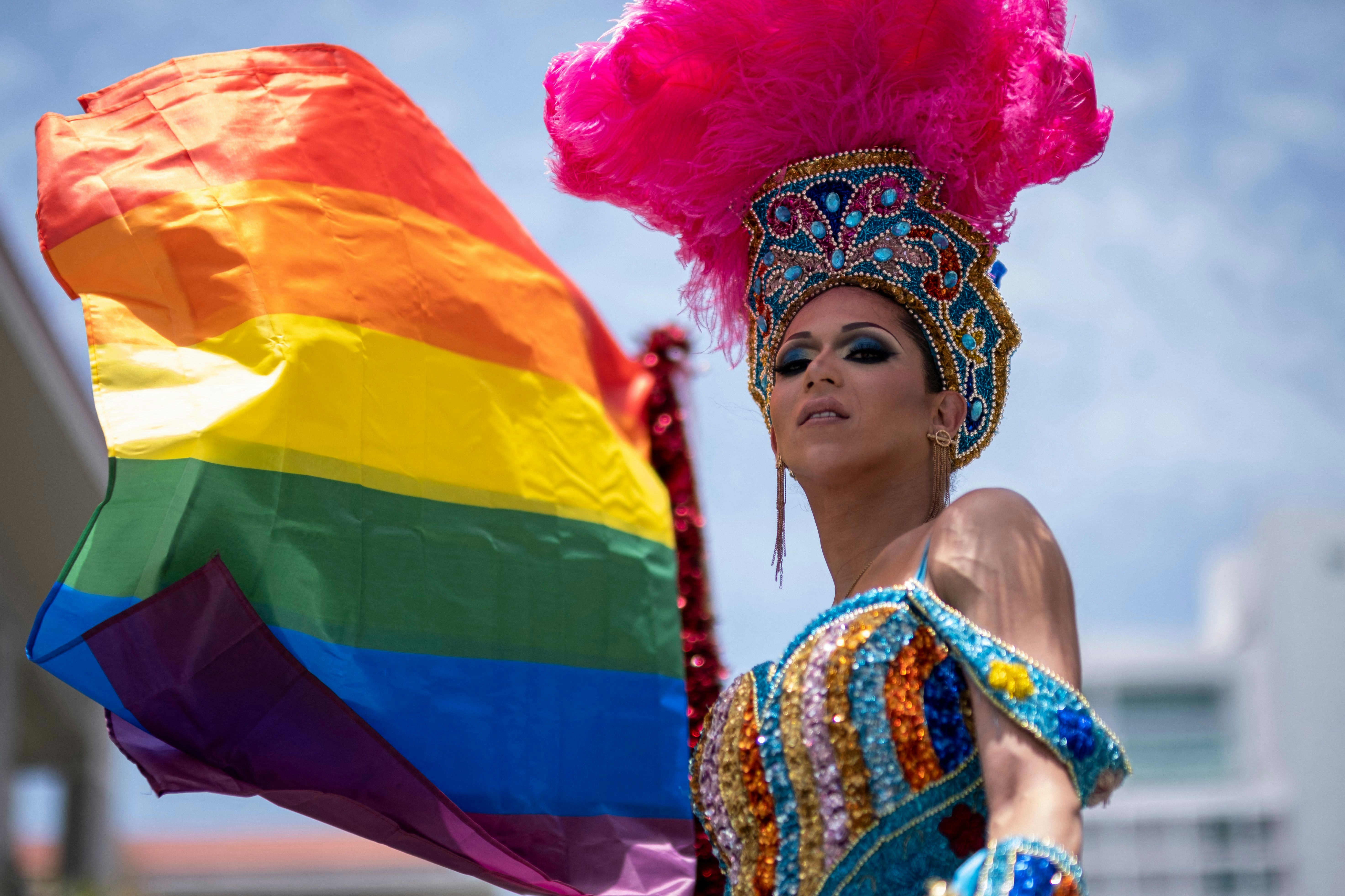 People take part in the annual Pride Parade in San Juan, Puerto Rico on June 5, 2022. (Photo by Rica...