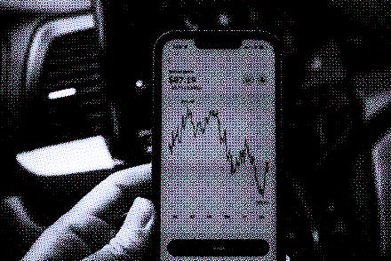 Person's hand holding an iPhone displaying chart of the price of Solana cryptocurrency, Lafayette, C...