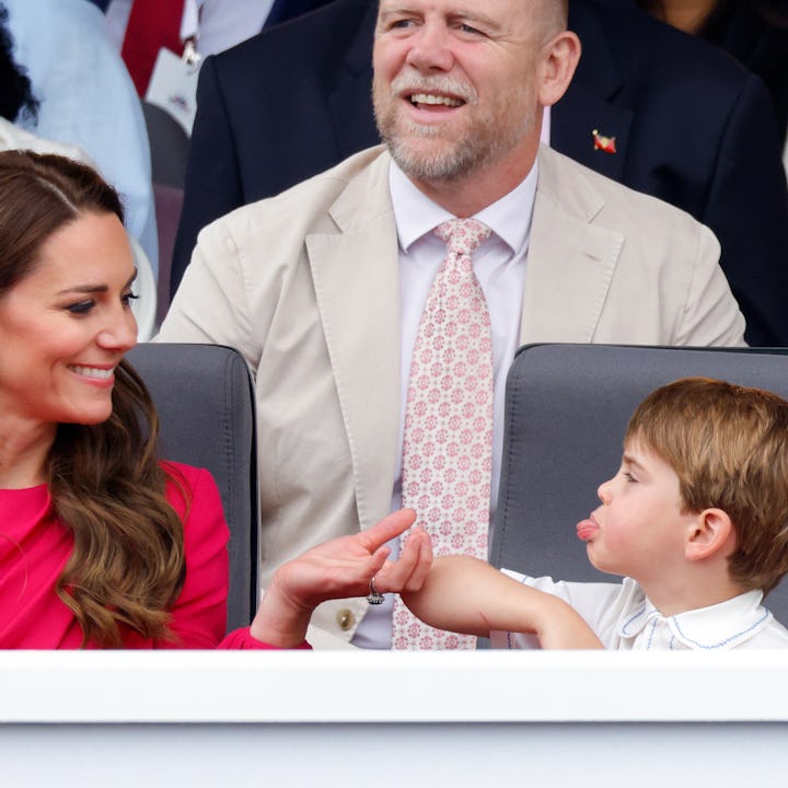 Prince Louis of Cambridge sticks his tongue out at his mother Catherine, Duchess of Cambridge as the...