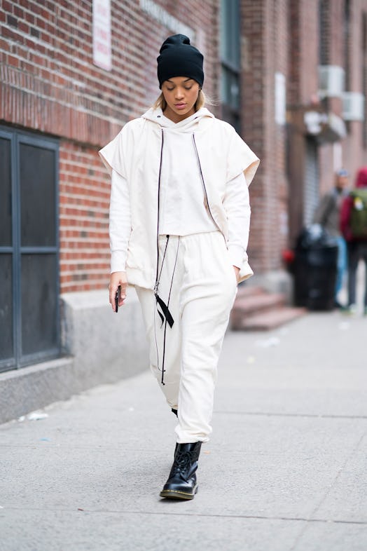 Jasmine Sanders is seen wearing Daniel Patrick sweatsuit and vest with Dr. Martens shoes and Quay su...