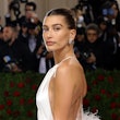 Hailey Bieber at the 2022 Met Gala wearing a backless dress. Stick-on bras can help you pull off loo...