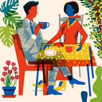 Two People Sitting at a Table Having Coffee