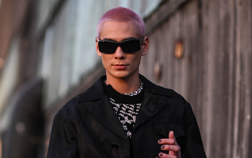 NEW YORK, NEW YORK - MARCH 15: Evan Mock is seen wearing a black jacket and Alexander McQueen pants ...