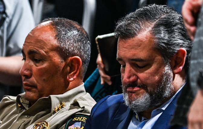 Uvalde County Sheriff Ruben Nolasco (L) and US Senator Ted Cruz (R) a Republican from Texas, look on...