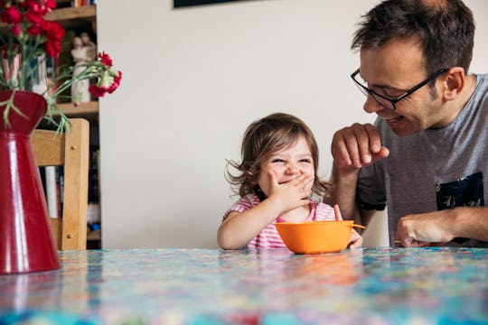 A father and daughter sitting at the kitchen table, father's day dad jokes