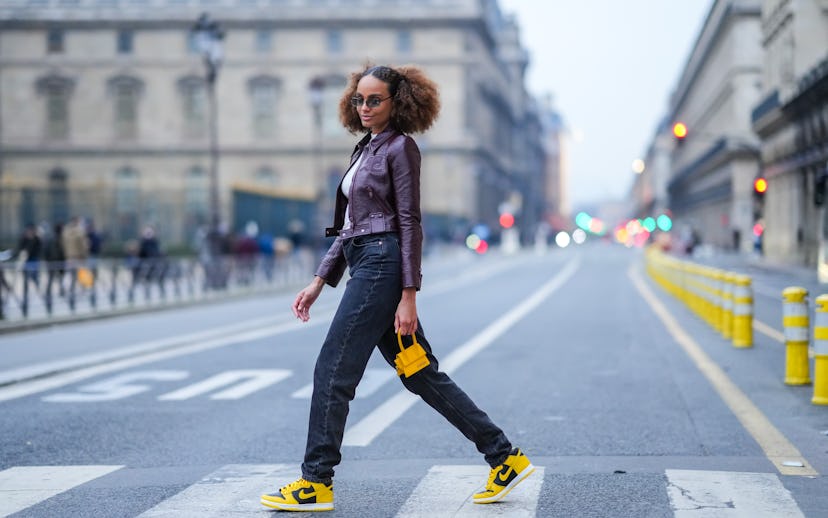 PARIS, FRANCE - DECEMBER 22: Alicia Aylies wears sunglasses, a white high neck pullover from Courreg...