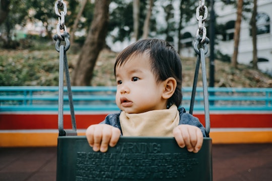 cute baby on swing, baby names like archie