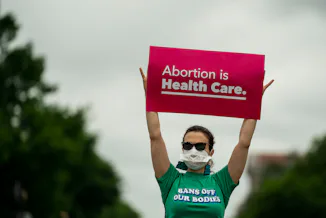 WASHINGTON, DC - MAY 14: Abortion rights activists participate in a Bans Off Our Bodies rally and m...