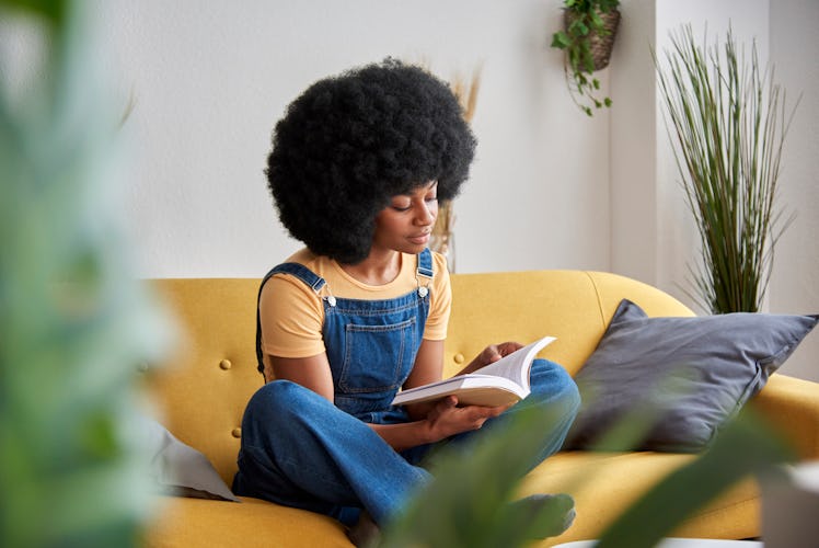Woman enjoying reading a book and taking time for herself.