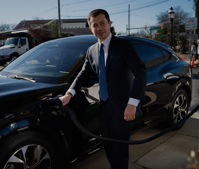 Takoma Park, MD - December 14: Transportation Secretary Pete Buttigieg, plugs the electric car in th...