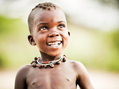 A curious young African child of the Hadzabe tribe (Africa's last hunter/gatherer tribe) in Tanzania...