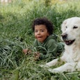 Although it may seem cute when your dog "guards" your child, it could indicate behavioral issues in ...