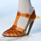 A model wears jelly shoes, a Y2K fashion trend.