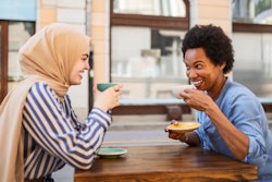 Woman wearing hijab chatting during coffee break with her friend. Here's your june 10 daily horoscop...