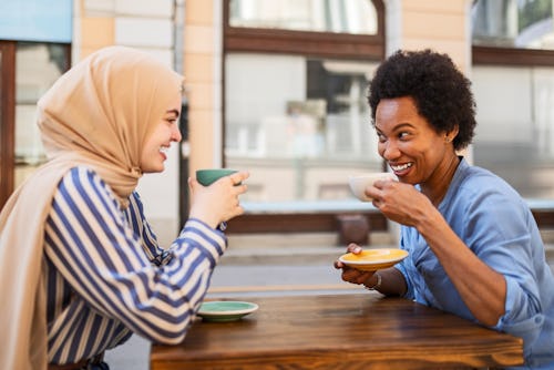 Woman wearing hijab chatting during coffee break with her friend. Here's your june 10 daily horoscop...
