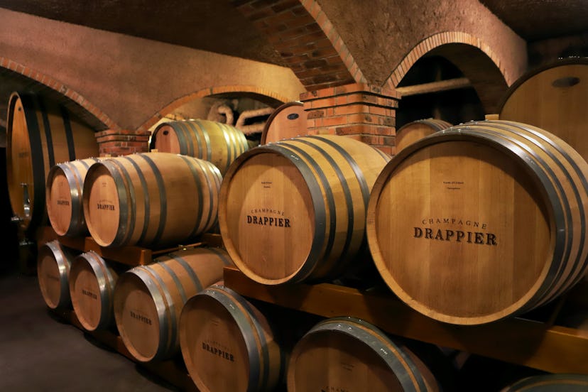  Wine ages in oak barrels in the 12th century cellars of Champagne Drappier winery 