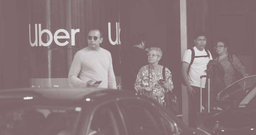CHICAGO, ILLINOIS - MAY 09: Travelers wait for an Uber ride at Midway International Airport on May 0...