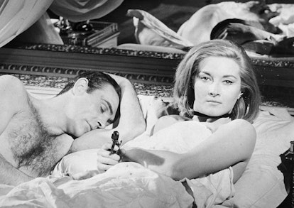 Scottish actor Sean Connery lies in bed with Italian actress Daniela Bianchi in a still from the Jam...