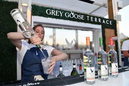 NEW YORK, NEW YORK - JULY 10: Bartenders mix Grey Goose Essences cocktails at IN BLOOM, imagined by ...