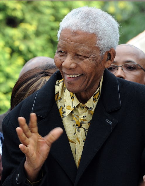 South African former President Nelson Mandela greets voters at a polling station in Johannesburg dur...