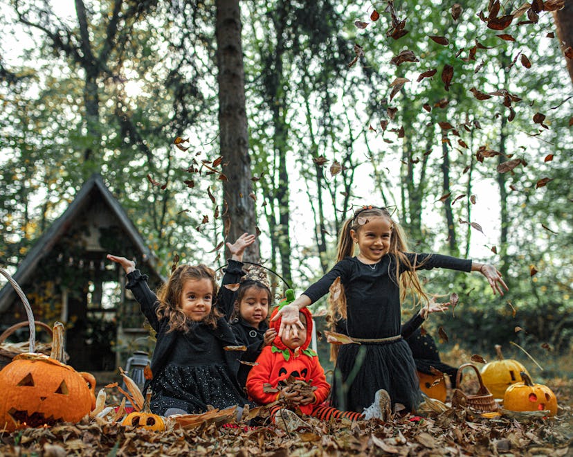 Little girls in Halloween costumes dancing and having a Halloween party in an article about if Party...