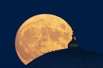 EDIRNE, TURKEY - JULY 23: Full moon rises behind the Selimiye Mosque over Edirne, Turkey on July 23,...