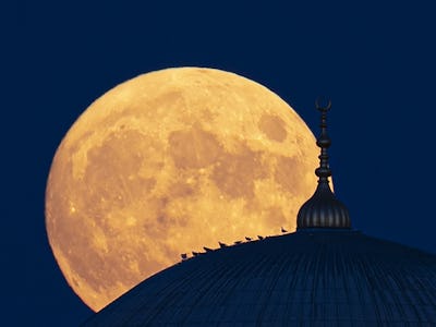 EDIRNE, TURKEY - JULY 23: Full moon rises behind the Selimiye Mosque over Edirne, Turkey on July 23,...