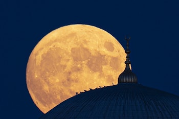 EDIRNE, TURKEY - JULY 23: Full moon rises behind the Selimiye Mosque over Edirne, Turkey on July 23,...