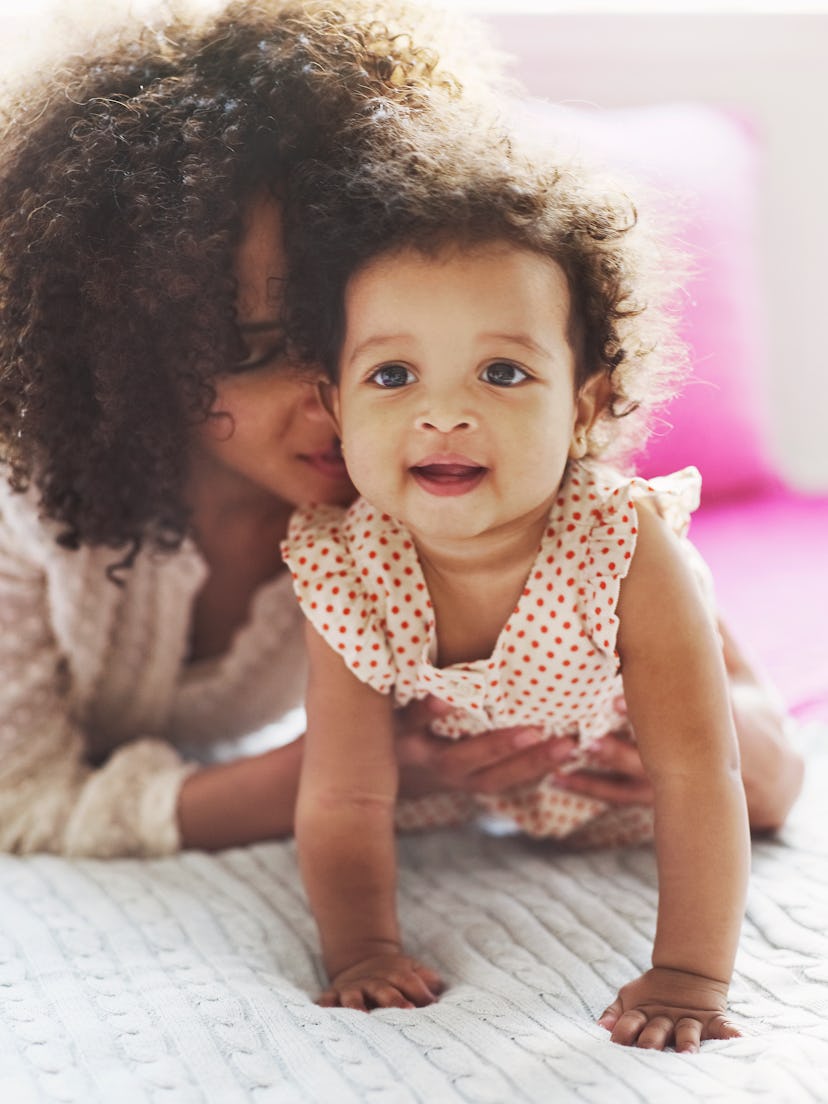 a mom and baby girl in an article round up of girl names that start with P