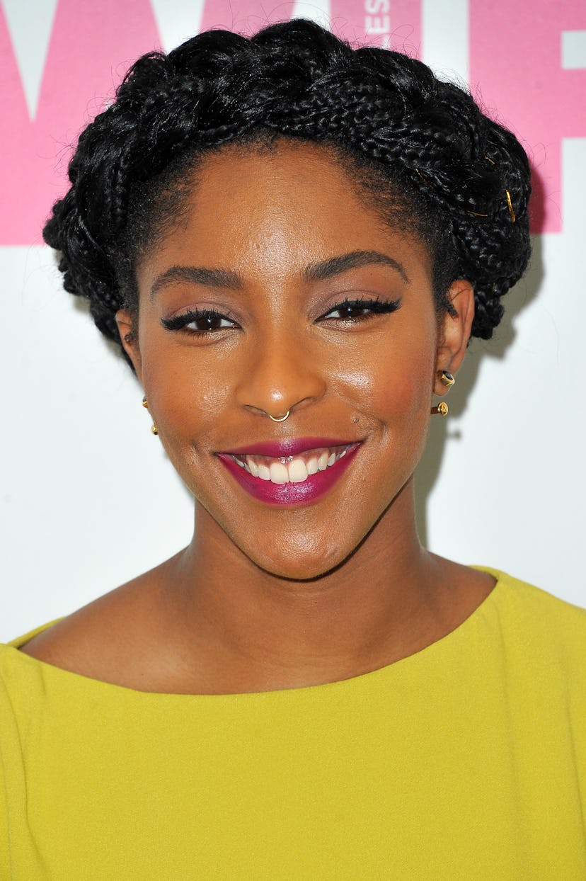 Jessica Williams wears braided French braids wrapped around the top of her head at the Women In Film...