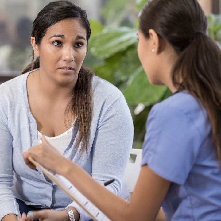 A pediatrician talks with a mother. A new study shows that parents - both gun-owners and non-owners ...