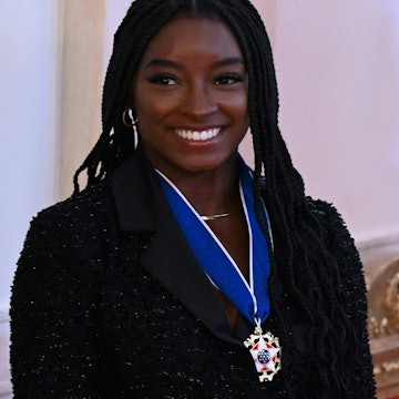 After being awarded the Presidential Medal of Freedom, Simone Biles was mistaken for a child by a fl...