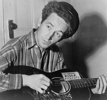 Portrait photograph of Woody Guthrie (Woodrow Wilson Guthrie) (1912-1967) American singer-songwriter...