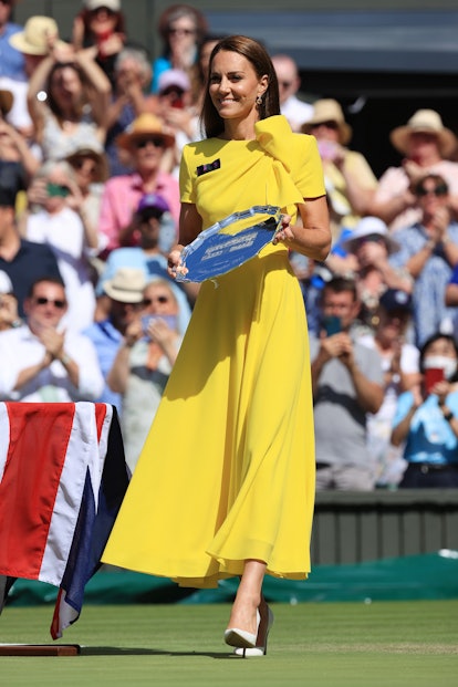 Catherine, Duchess of Cambridge, holds the runner-up plate trophy after the Ladies' Singles Final du...