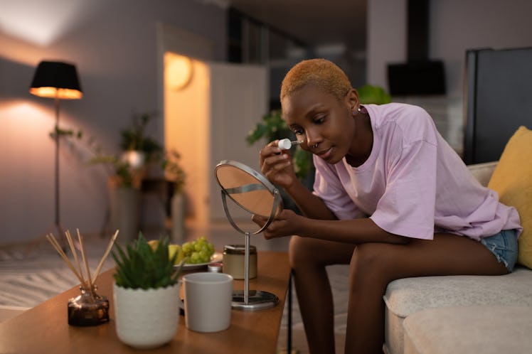 A woman shows off her night skincare routine on Reels as an Instagram reel idea for summer.