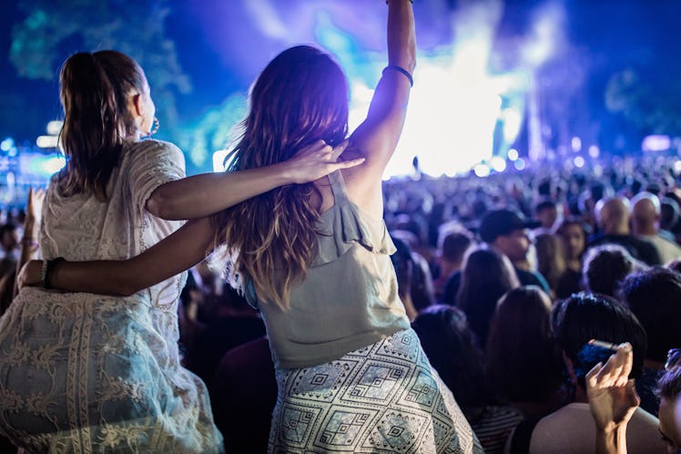 Friends having fun on a country concert by night need summer concert captions for Instagram.