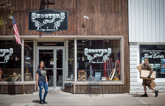 Owner Lauren Boebert (L) poses for a portrait outside Shooters Grill in Rifle, Colorado on April 24,...