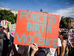 LONDON, UNITED KINGDOM - 2022/07/09: Protesters hold placards expressing their opinion during the de...