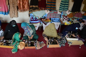 Women stich garments at the workshop of a women run company in Kandahar on May 21, 2022. (Photo by J...