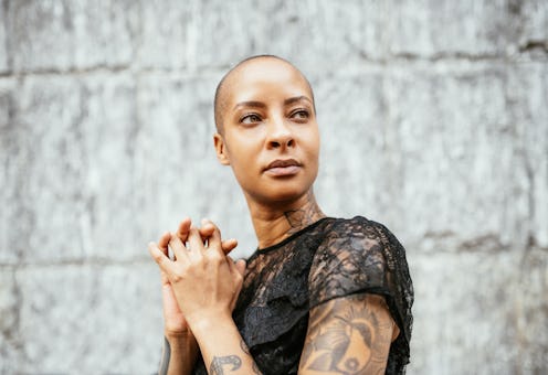 Tattooed short hair multiracial woman