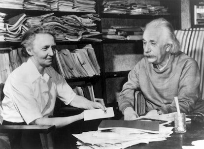 Albert Einstein (1879-1955) and Madame Irene Joliet-Curie talking together in the study of Einstein'...