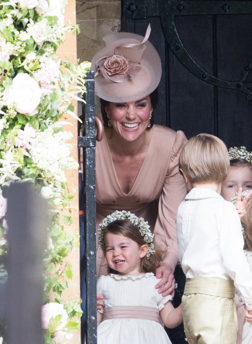 Princess Charlotte puts on a happy face.