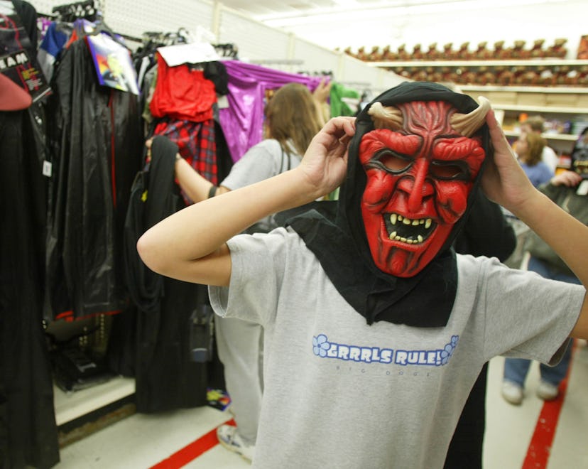 PRINCE FREDERICK, VA - OCTOBER 28: kid tries on mask at Wal-mart store in Prince Frederick, Virgini...