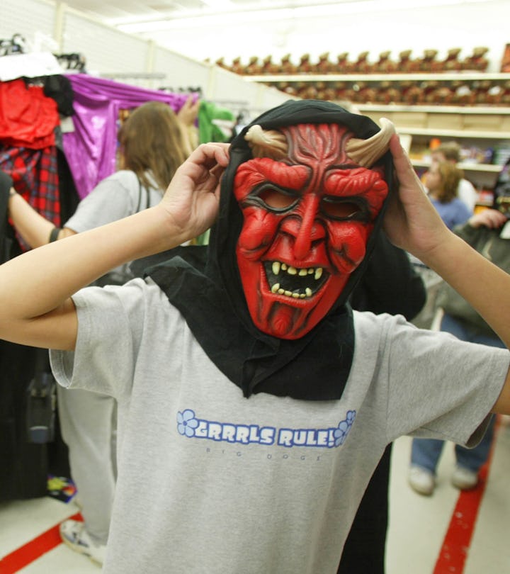 PRINCE FREDERICK, VA - OCTOBER 28:  kid tries on mask at Wal-mart store in Prince Frederick, Virgini...