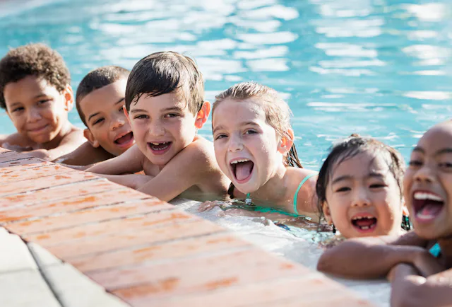 kids at the community pool in the summer